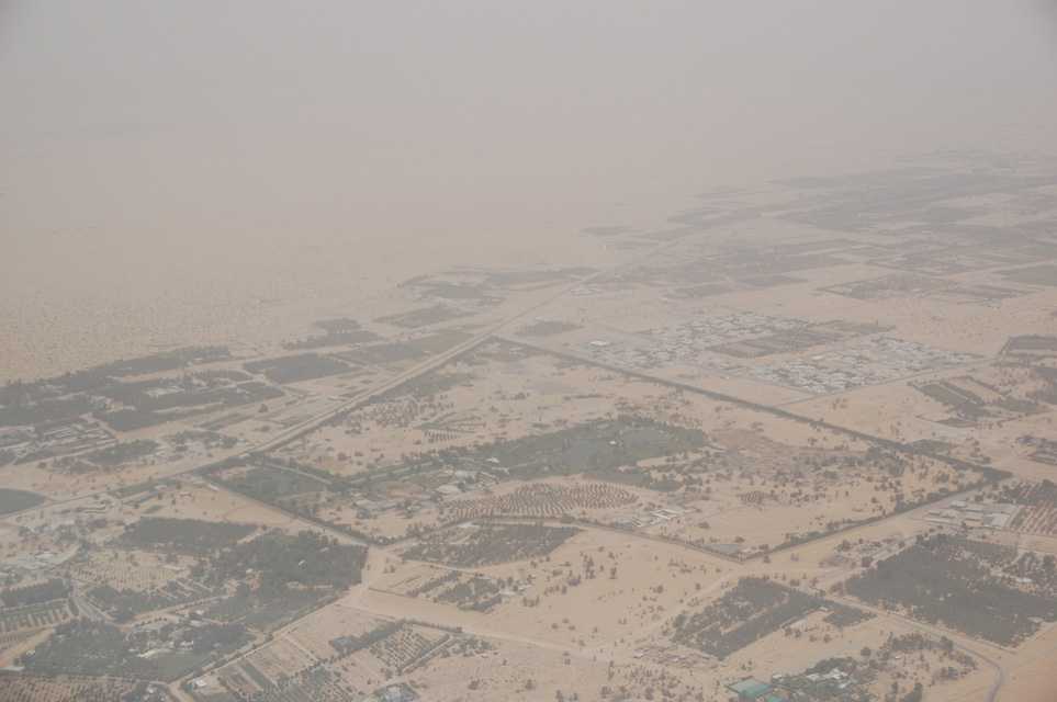 DXB Dubai from aircraft - residential area with trees on the border with the desert 01 3008x2000