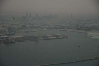 DXB Dubai from aircraft - Port Rashid and the Jumeirah skyscrapers at dawn 01 3008x2000