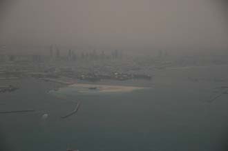 DXB Dubai from aircraft - Port Rashid land reclaiming and the Jumeirah skyscrapers at dawn 01 3008x2000