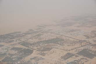 DXB Dubai from aircraft - residential area with trees on the border with the desert 01 3008x2000