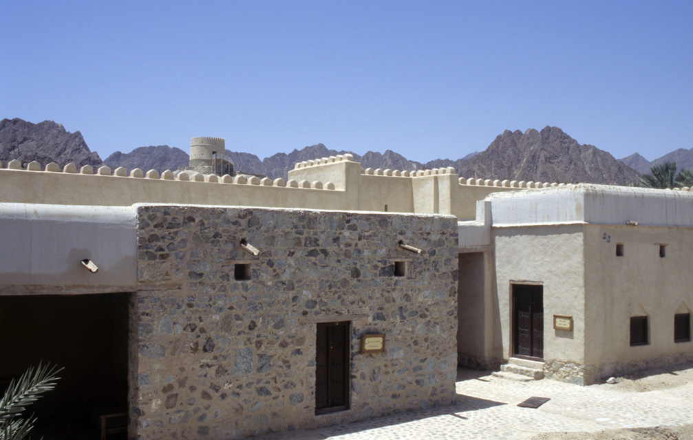 DXB Hatta Heritage Village - traditional houses with watchtower and Hajar mountains 5340x3400