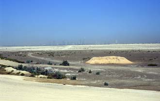 DXB Dubai - the skyline of Jumeirah with desert seen from the highway leaving Dubai in south-eastward direction towards Hatta Oasis 01 5340x3400