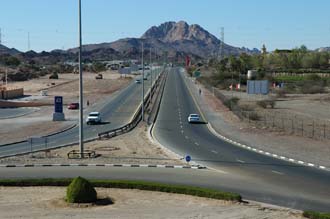 DXB Hatta - street to Dubai and Big Red Dune seen from the tower in the Fort roundabout in Hatta Town 3008x2000
