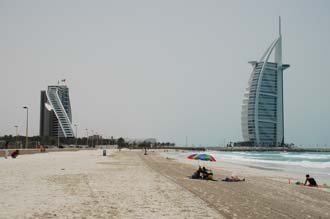 DXB Dubai Jumeirah Beach - Burj Al Arab Hotel and Jumeirah Beach Hotel with white sandy beach and sunshade 3008x2000