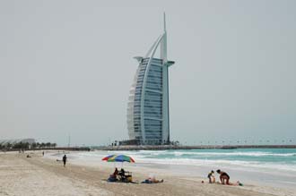 DXB Dubai Jumeirah Beach - Burj Al Arab Hotel with white sandy beach and sunshade 01 3008x2000