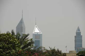 DXB Dubai Jumeirah Beach - Emirates Towers with palm-trees from Jumeirah Mosque 3008x2000