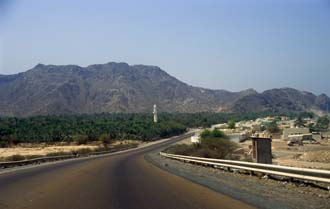 DXB Dibba - road from Khor Fakkan to Dibba with mosque in date palm plantation and Hajar mountains 5340x3400